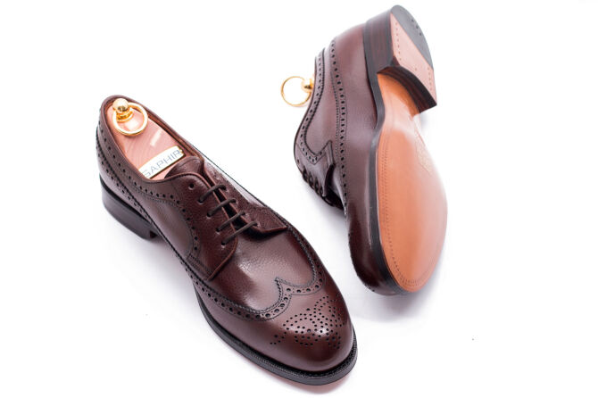 casualowe eleganckie z ażurkami i dekoracyjnymi zdobieniami obuwie męskie yanko 14741 chesnut marron.. Eleganckie obuwie koloru brązowego typu brogues z skórzaną podeszwą. Szyte metodą ramową.