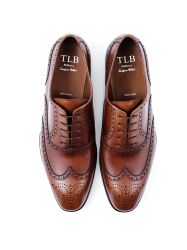  Eleganckie obuwie koloru brązowego typu brogues z skórzaną podeszwą. Szyte metodą ramową.