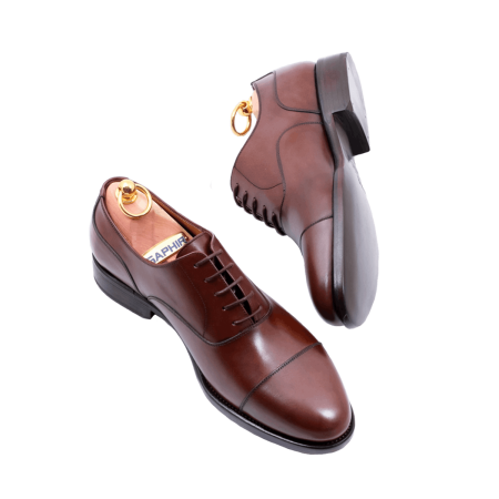 Klasyczne brązowe wiedeńki PATINE 77001 G Brown wykonane z wysokiej jakości skóry naturalnej. Elegancki model Oxford Cap Toe dla miłośników ponadczasowego stylu.
